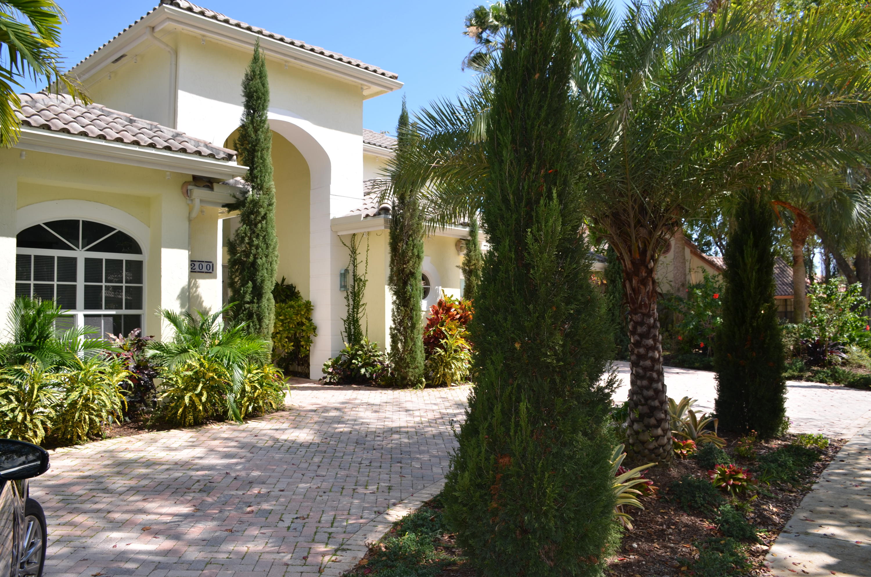 1200 Parkside Avenue Boca Raton, FL 33486 - Photo 2 of 33 a front view of a house with a yard