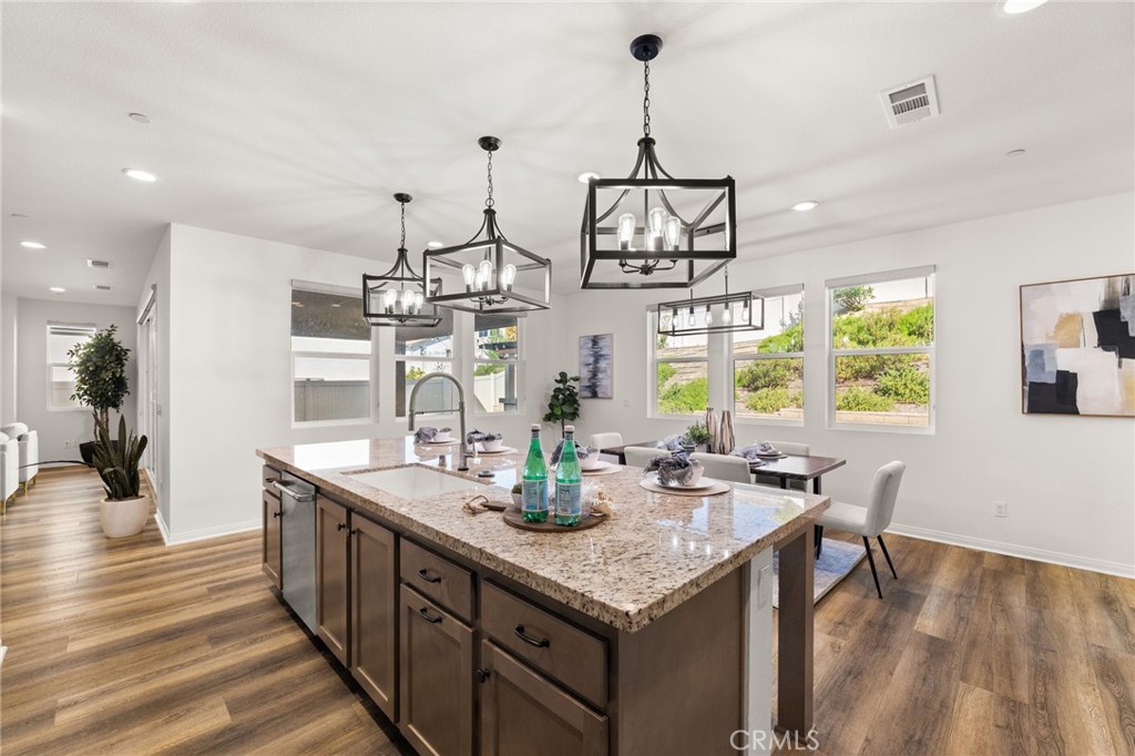 32448 Toyon Road Temecula, CA 92591 - Photo 13 of 72 a kitchen with stainless steel appliances granite countertop a sink and cabinets