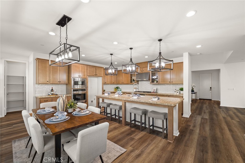 32448 Toyon Road Temecula, CA 92591 - Photo 15 of 72 a large kitchen with a table and chairs