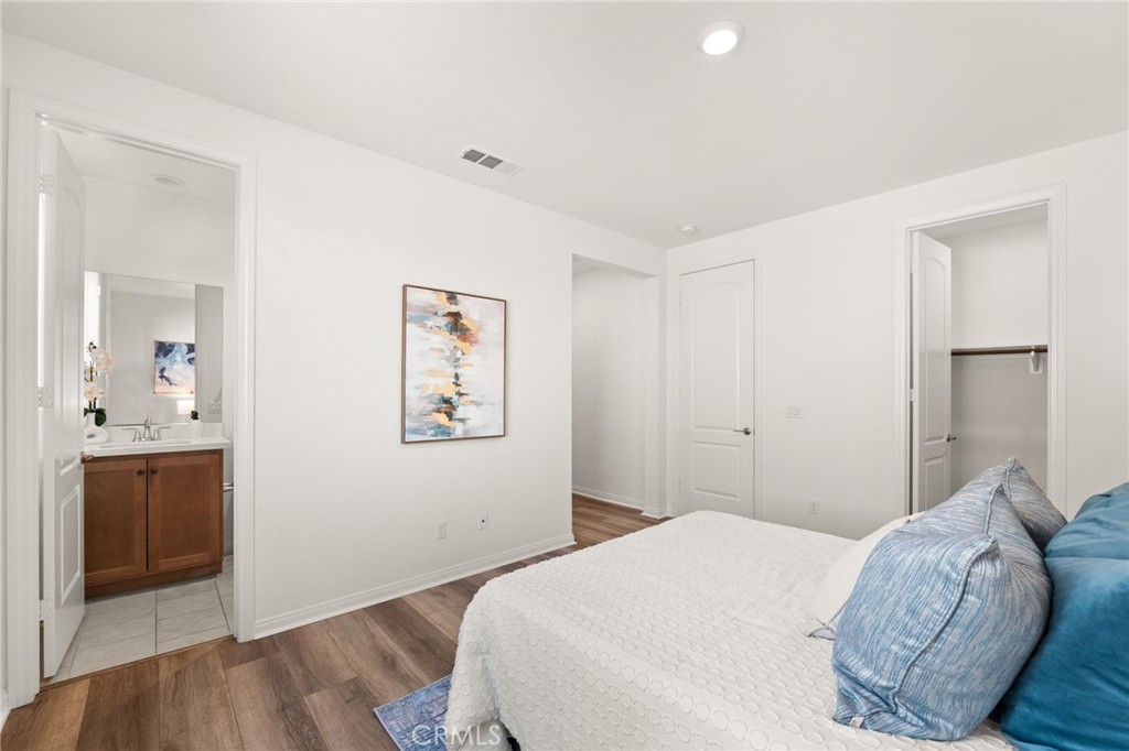 32448 Toyon Road Temecula, CA 92591 - Photo 22 of 72 a bedroom with a bed and a view of kitchen