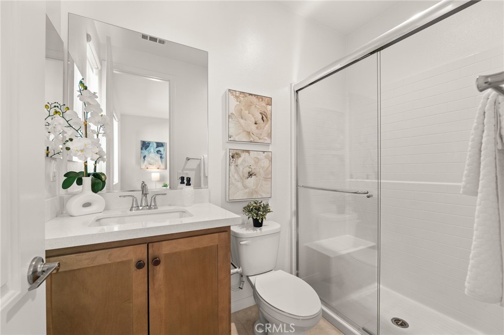 32448 Toyon Road Temecula, CA 92591 - Photo 23 of 72 a bathroom with a sink a toilet and shower