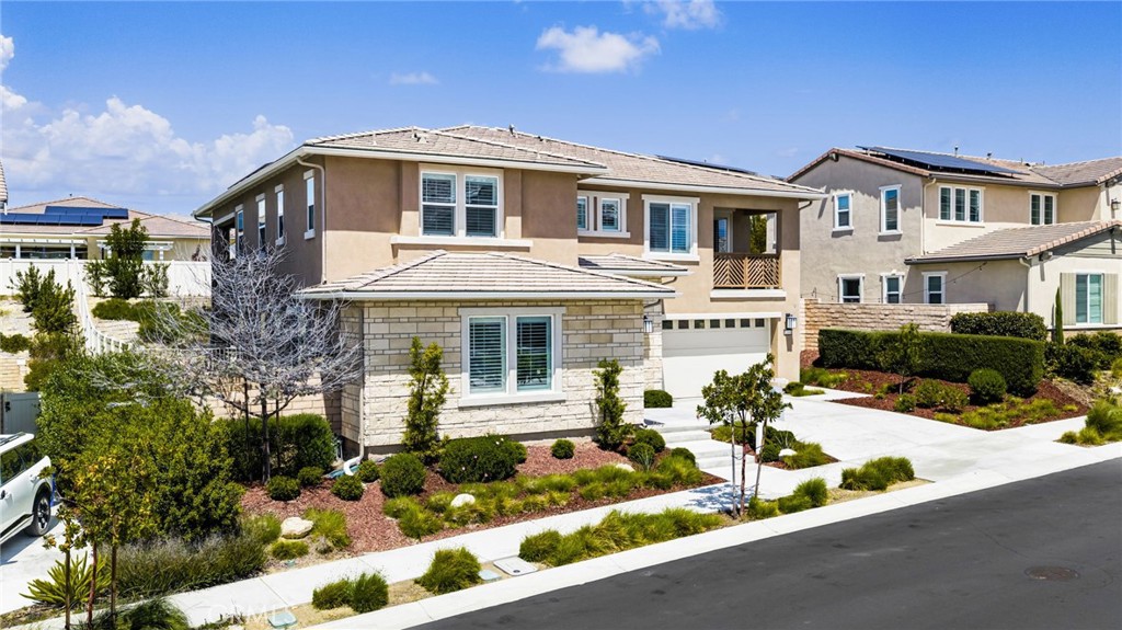 32448 Toyon Road Temecula, CA 92591 - Photo 3 of 72 a front view of a house with a yard and outdoor seating