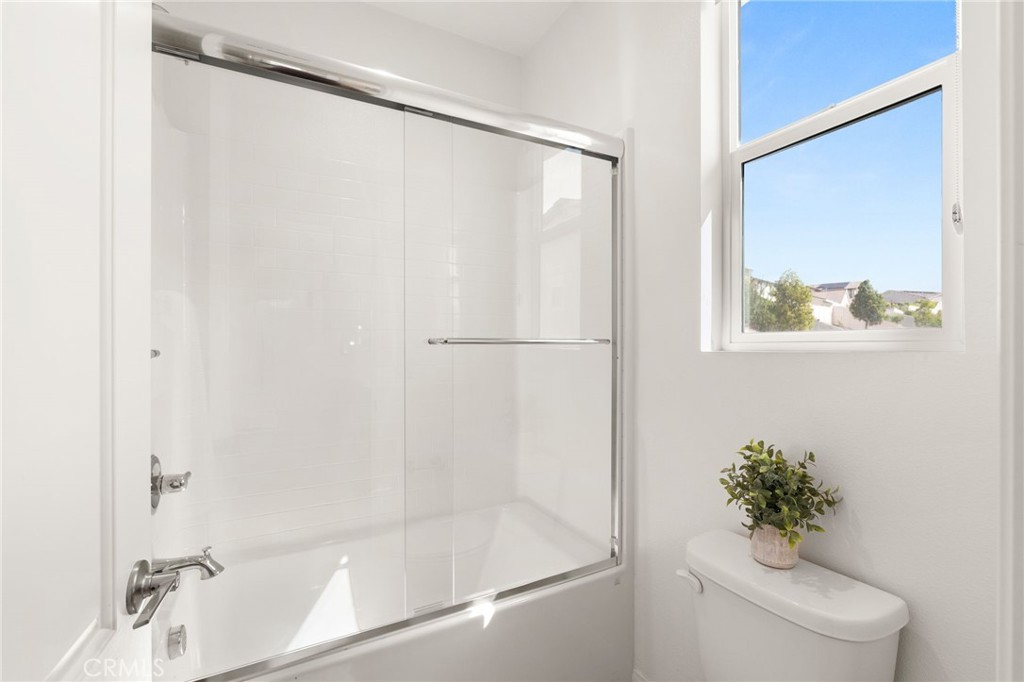 32448 Toyon Road Temecula, CA 92591 - Photo 31 of 72 a bathroom with a shower and a toilet