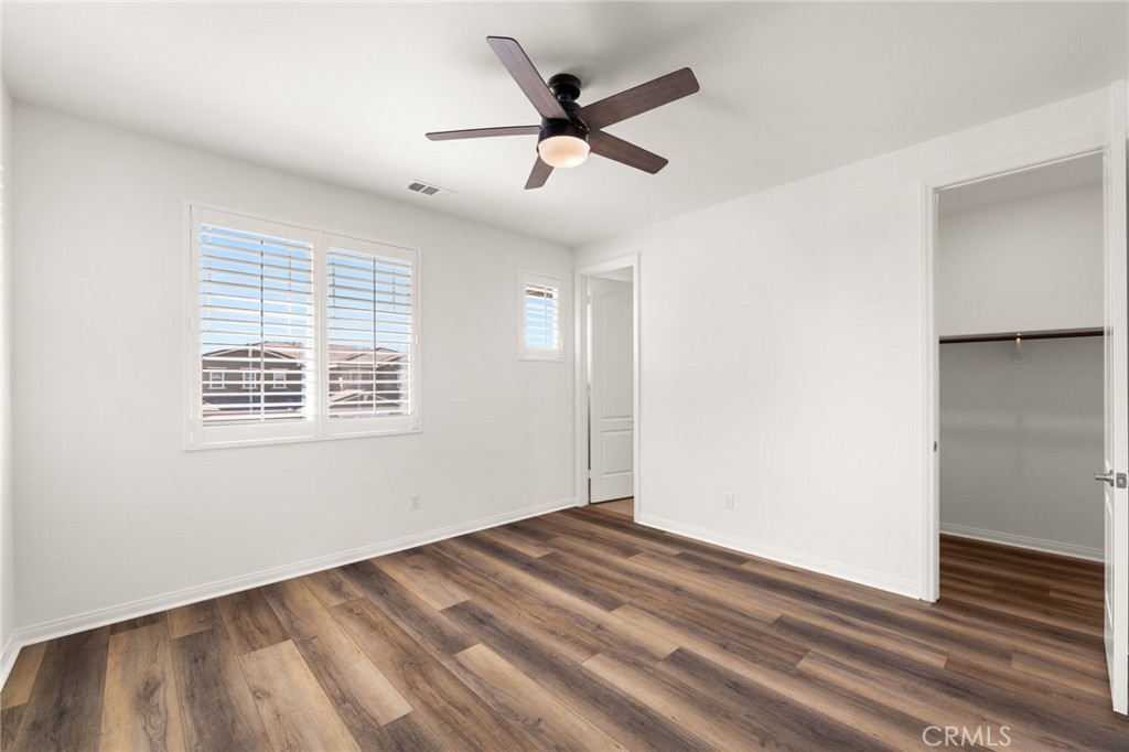 32448 Toyon Road Temecula, CA 92591 - Photo 34 of 72 a view of empty room with wooden floor and fan