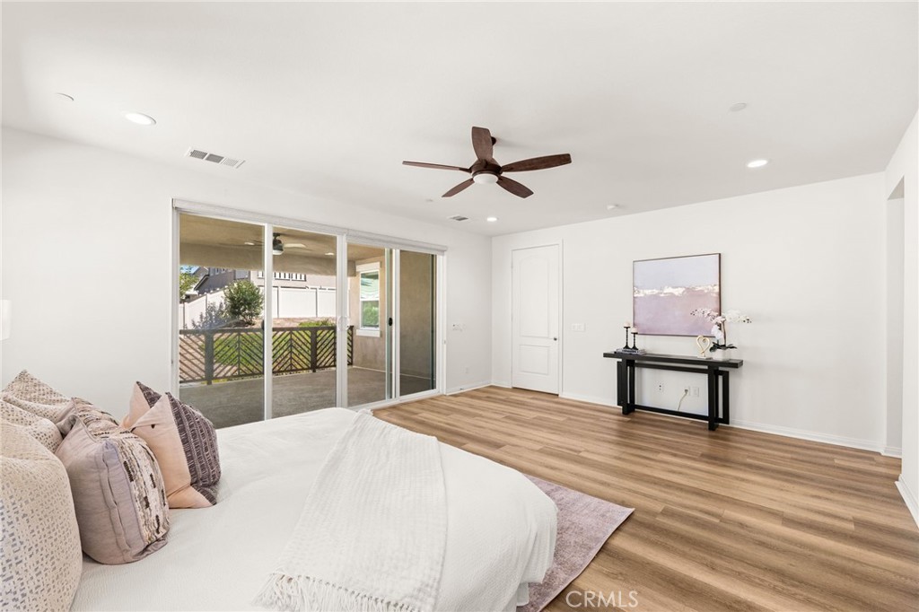 32448 Toyon Road Temecula, CA 92591 - Photo 43 of 72 a bedroom with a bed and a dresser next to a window