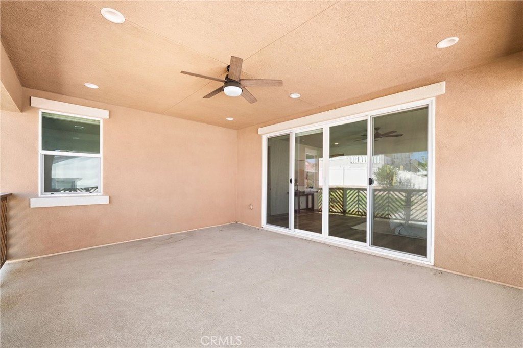32448 Toyon Road Temecula, CA 92591 - Photo 49 of 72 an empty room with a window and ceiling fan