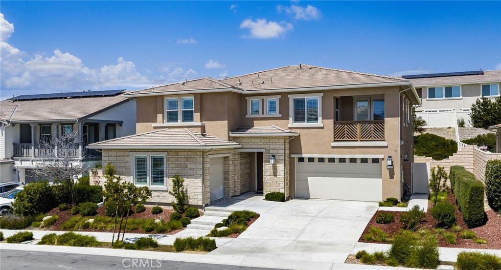 32448 Toyon Road Temecula, CA 92591 - Photo 5 of 72 a front view of a house with a garden