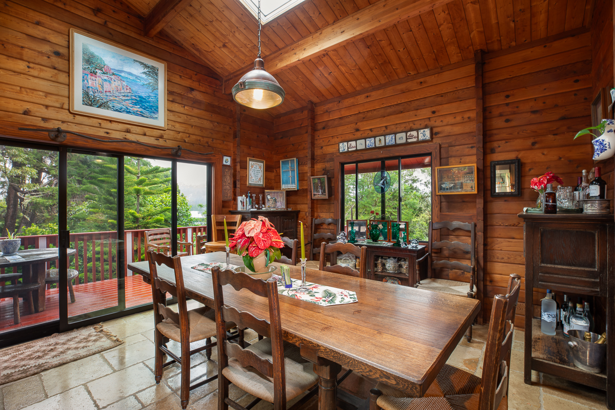 64-5097 White Road, Unit A Kamuela, HI 96743 - Photo 11 of 29 a view of a dining room with furniture large windows and wooden floor