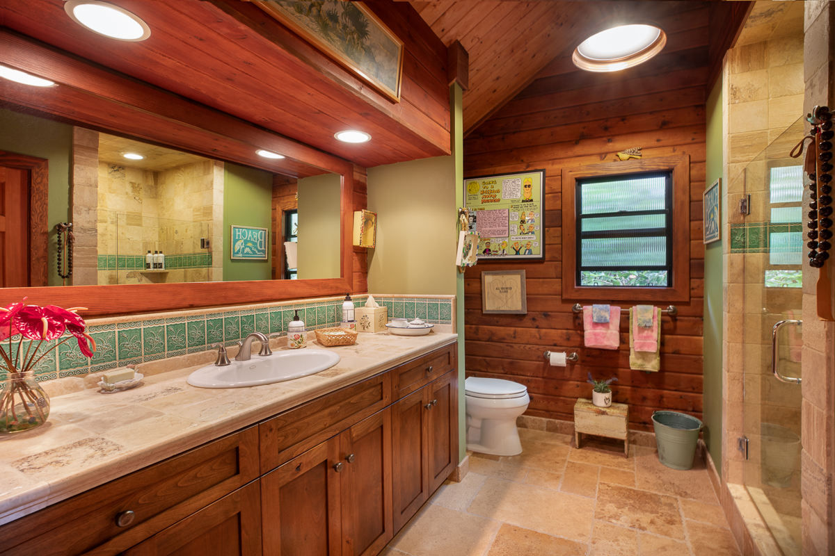 64-5097 White Road, Unit A Kamuela, HI 96743 - Photo 18 of 29 a bathroom with a granite countertop sink a toilet a mirror and shower