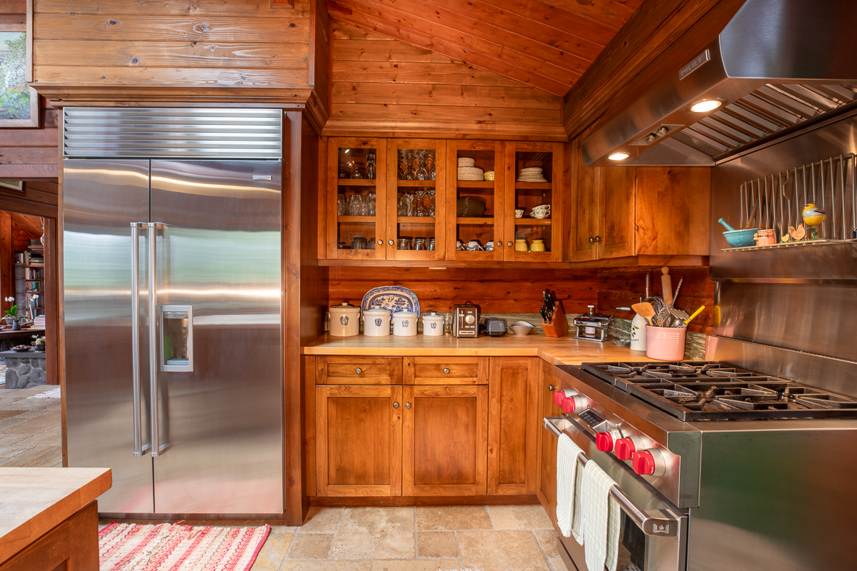 64-5097 White Road, Unit A Kamuela, HI 96743 - Photo 8 of 29 a kitchen with granite countertop a stove and a refrigerator