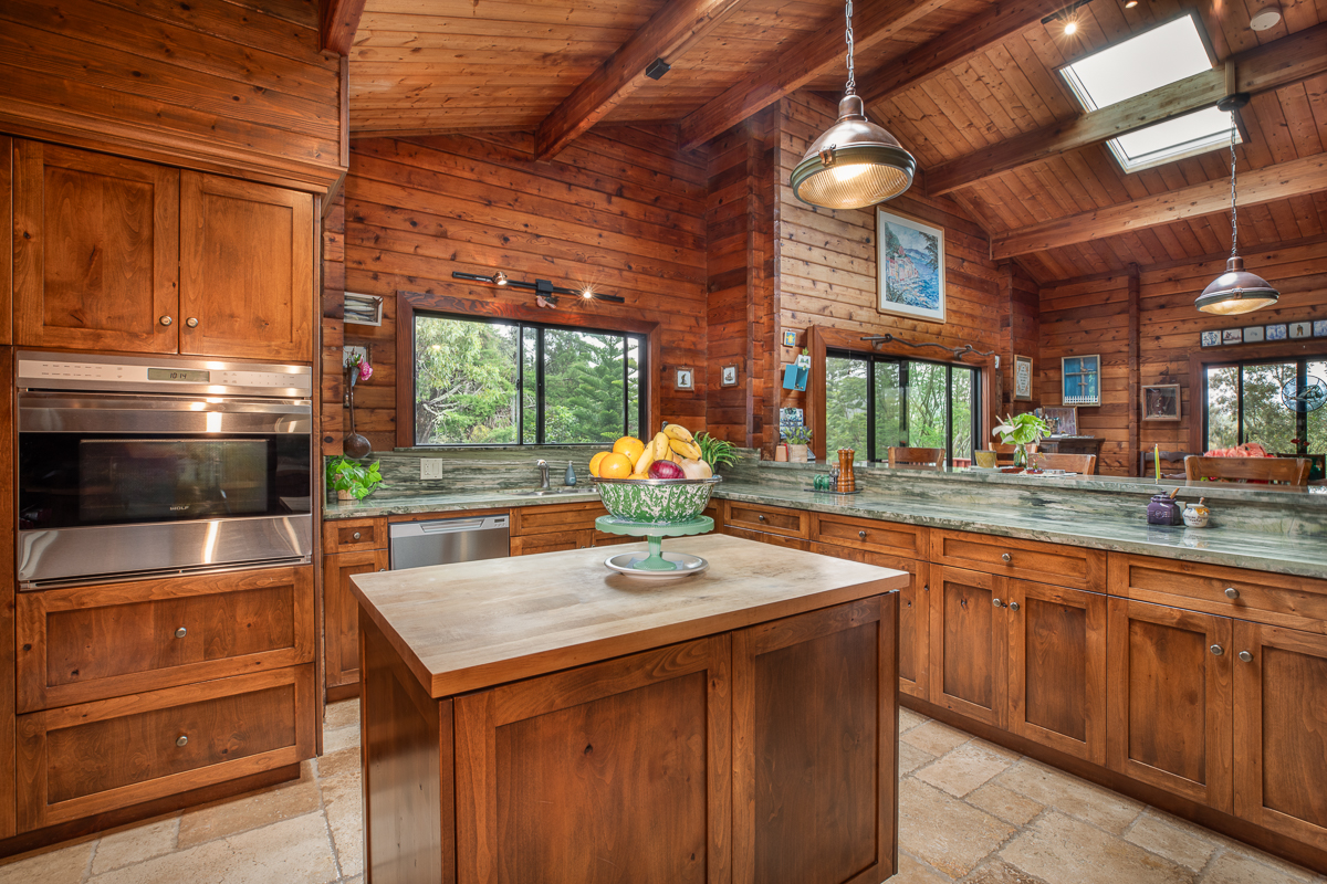 64-5097 White Road, Unit A Kamuela, HI 96743 - Photo 9 of 29 a kitchen with a sink and a stove next to a window