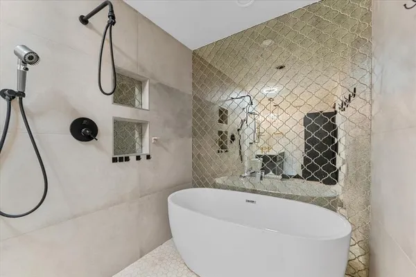 a bathroom with a sink a mirror and shower