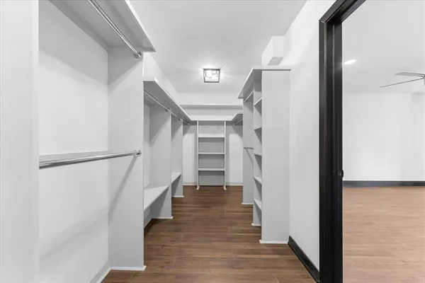 a view of entryway and hall with wooden floor