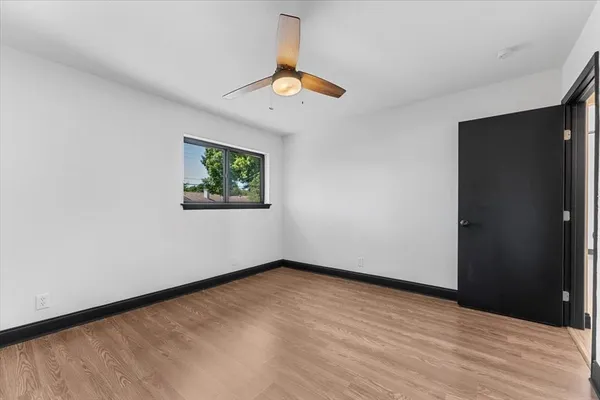 a view of room with window and ceiling fan
