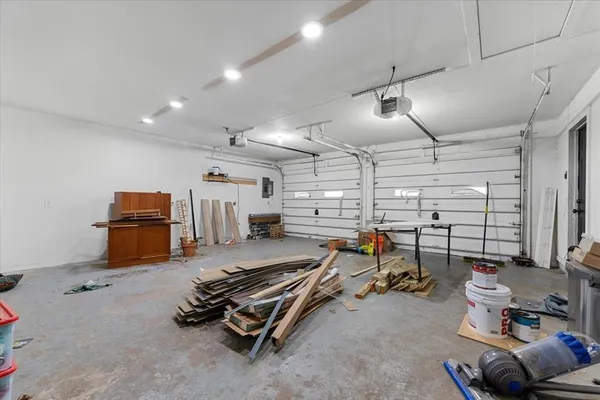 a room with gym equipment and windows