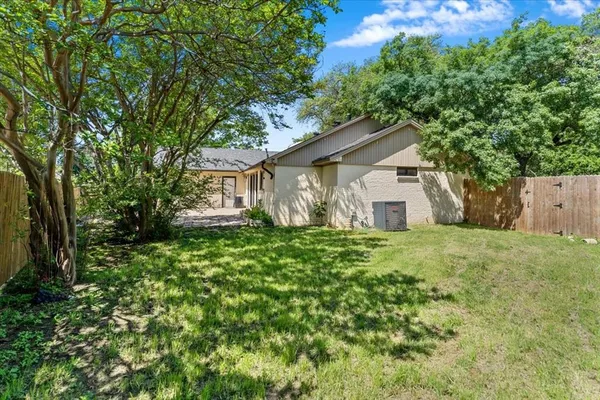 a view of a house with yard and a garden