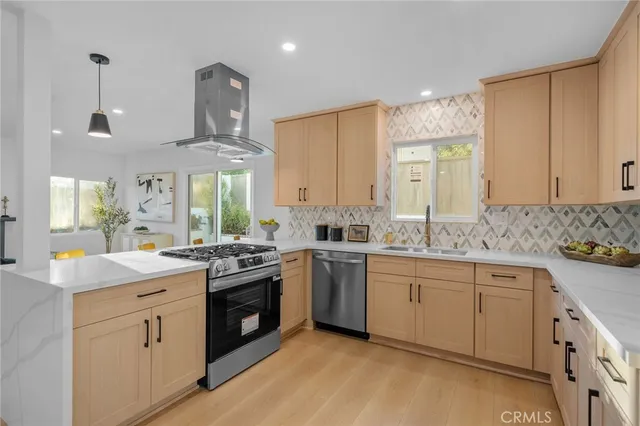 a kitchen with a sink stove and cabinets