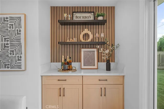 a kitchen with a sink and a mirror