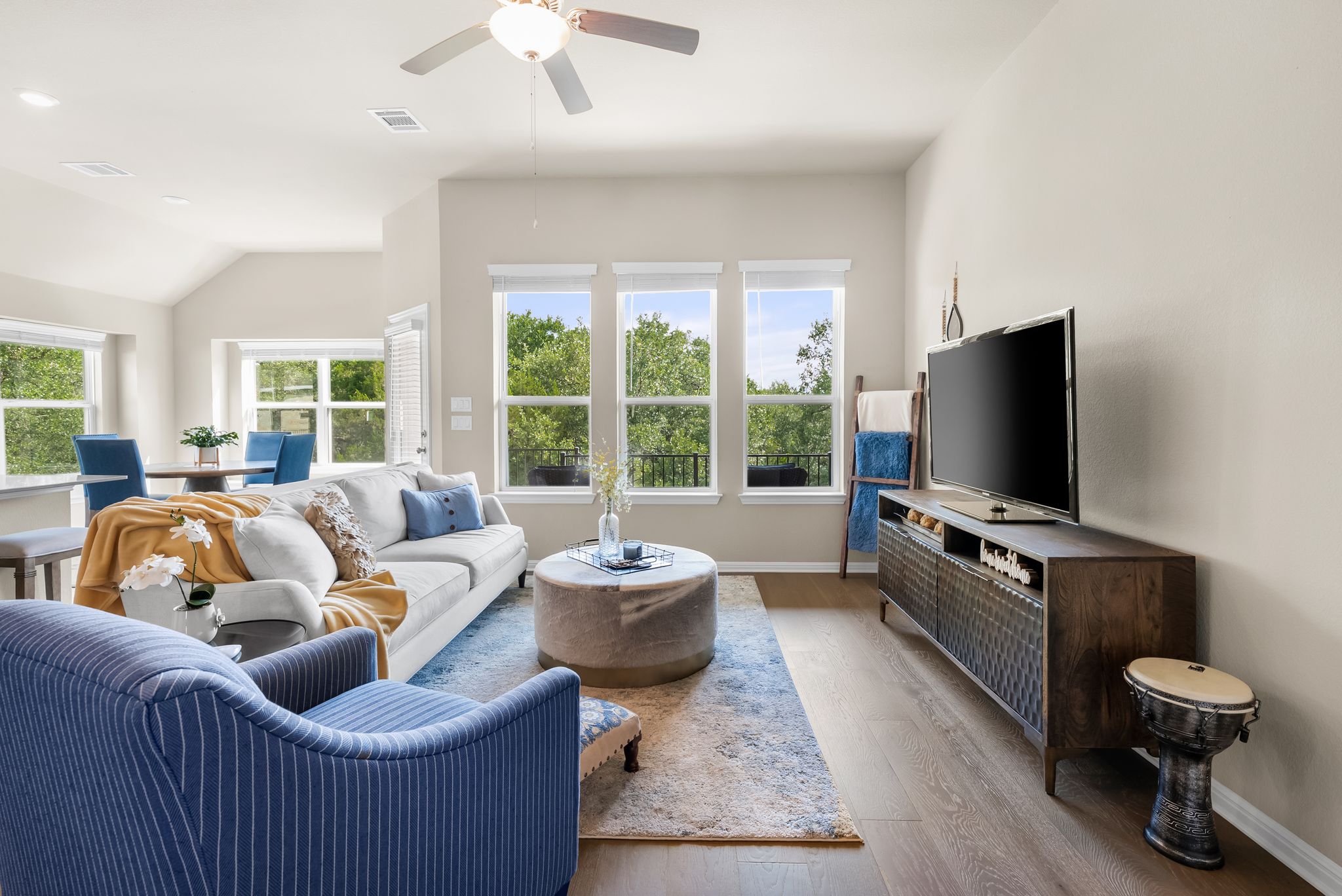 300 Prato Place Georgetown, TX 78628 - Photo 13 of 40 An open concept living area boasts rich hardwood flooring and abundant natural light.