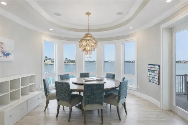 a view of a workspace with furniture and a bookshelf