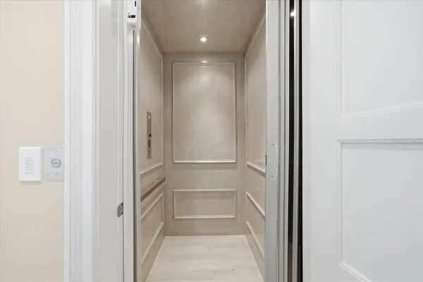 a bedroom with a flat screen television and a bed