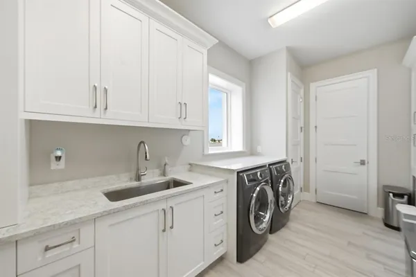 an aerial view of a house with a lake view