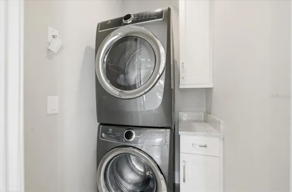 an aerial view of a house with a lake view