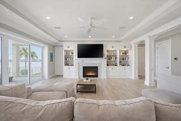 a large kitchen with stainless steel appliances granite countertop a lot of counter space and wooden floor