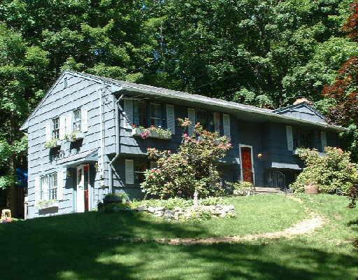 51 Longview Drive Ridgefield, CT 06877 - Photo 1 of 1 a front view of a house with a yard