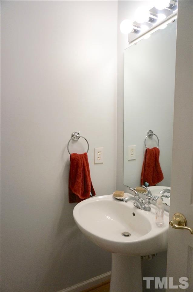 710 North Person Street, Unit 107 Raleigh, NC 27604 - Photo 13 of 21 a bathroom with a sink and a mirror