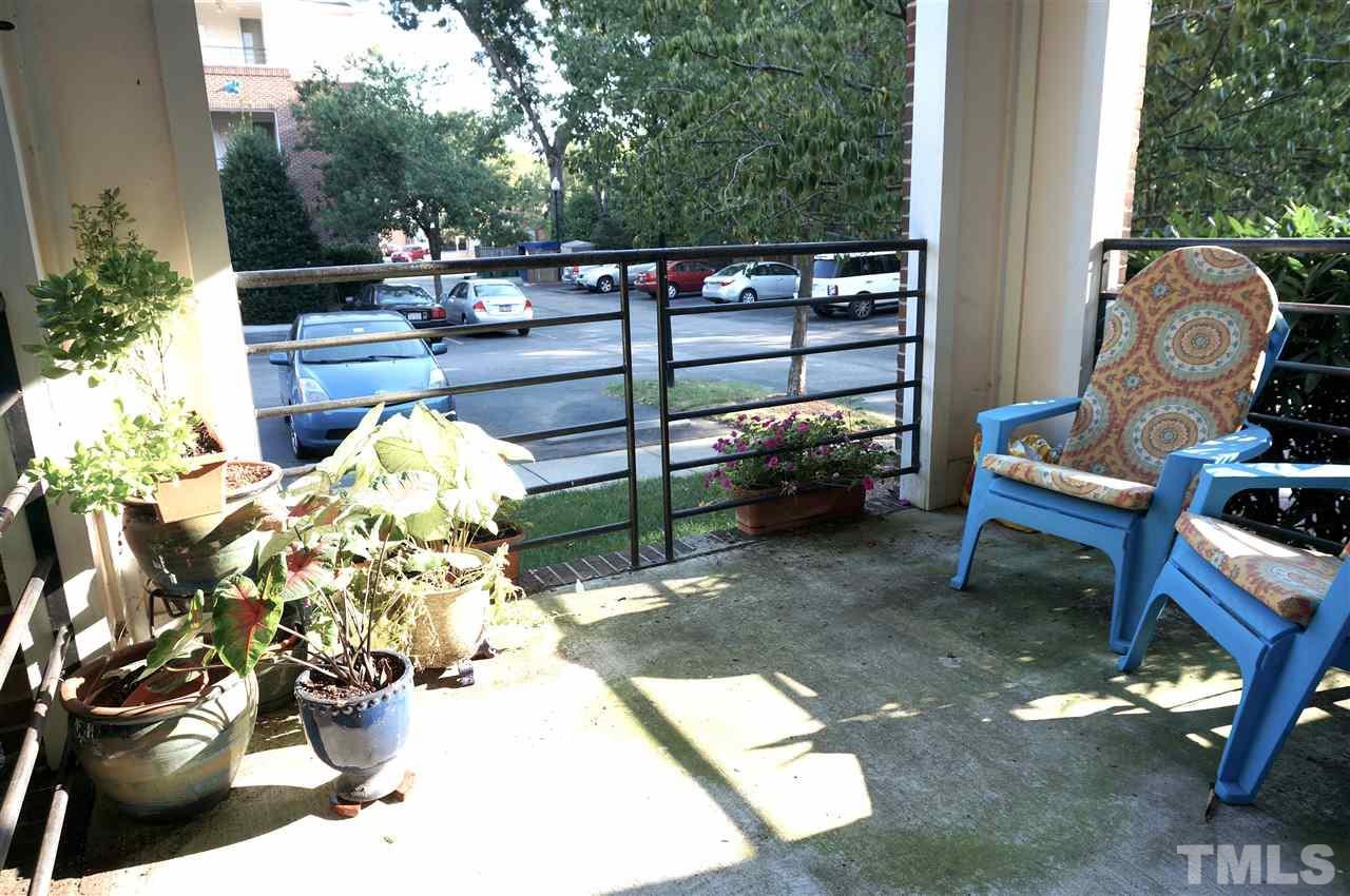 710 North Person Street, Unit 107 Raleigh, NC 27604 - Photo 15 of 21 a view of a chairs and table in the patio