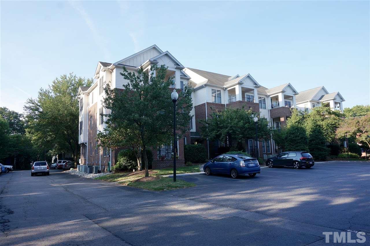 710 North Person Street, Unit 107 Raleigh, NC 27604 - Photo 3 of 21 a cars parked in front of a house