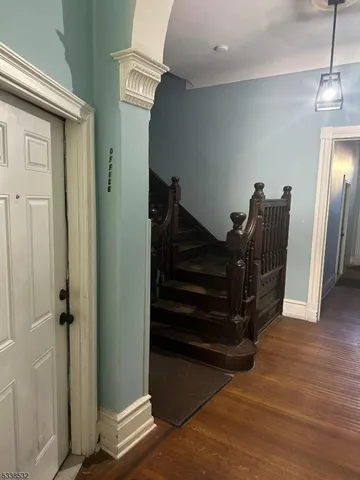 a hallway with wooden floor
