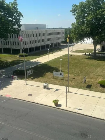 a view of a swimming pool and a yard