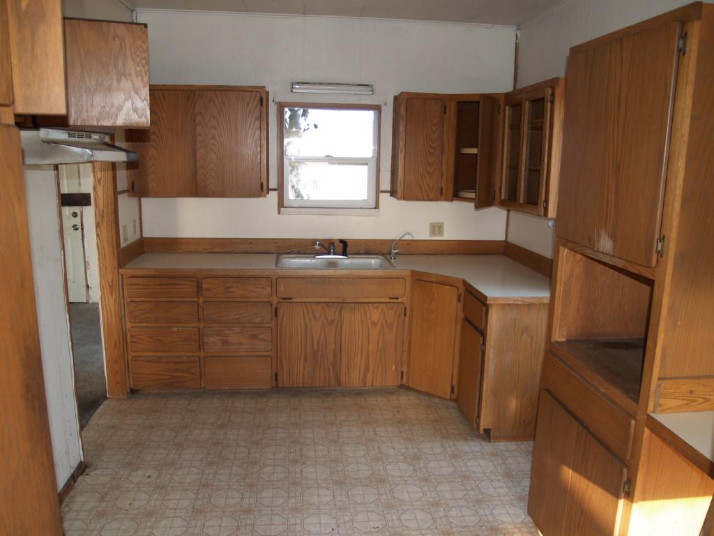 1921 Fordyce Road Sunnyside, WA 98944 - Photo 5 of 9 a kitchen with stainless steel appliances granite countertop a sink stove and refrigerator