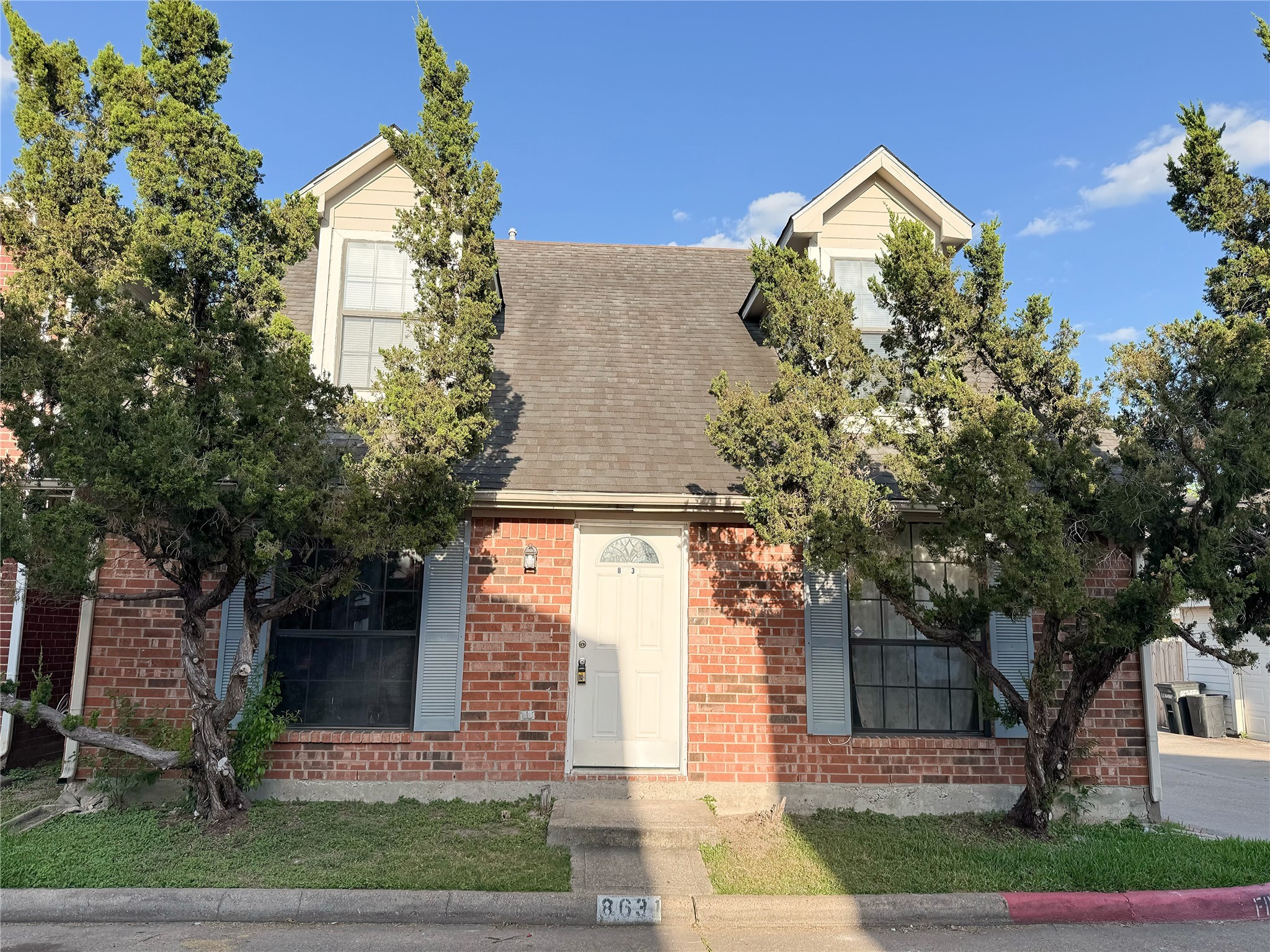 8631 Mapletwist Street Houston, TX 77083 - Photo 1 of 25 a front view of a house with garden