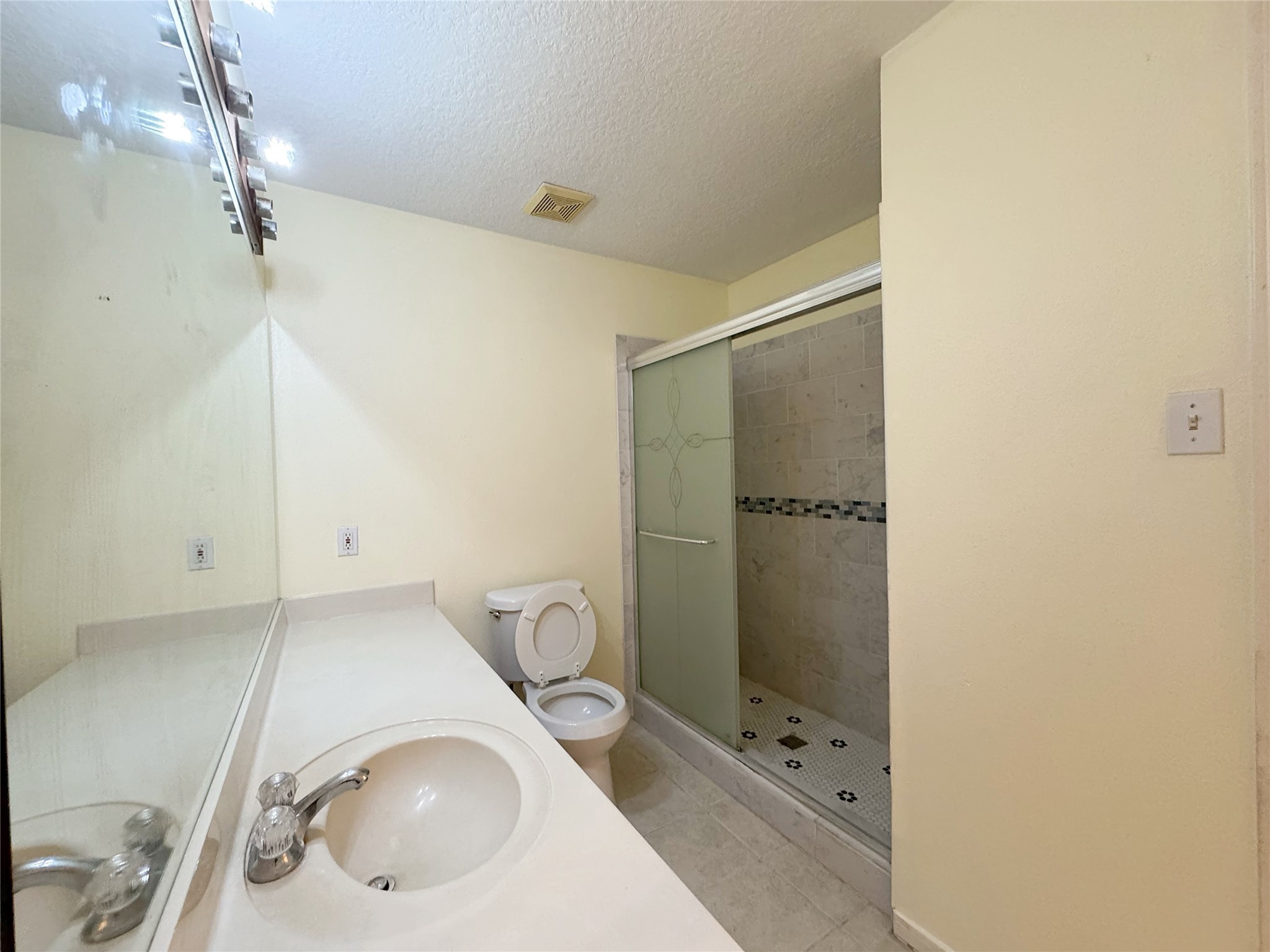 8631 Mapletwist Street Houston, TX 77083 - Photo 13 of 25 a bathroom with a sink and mirror