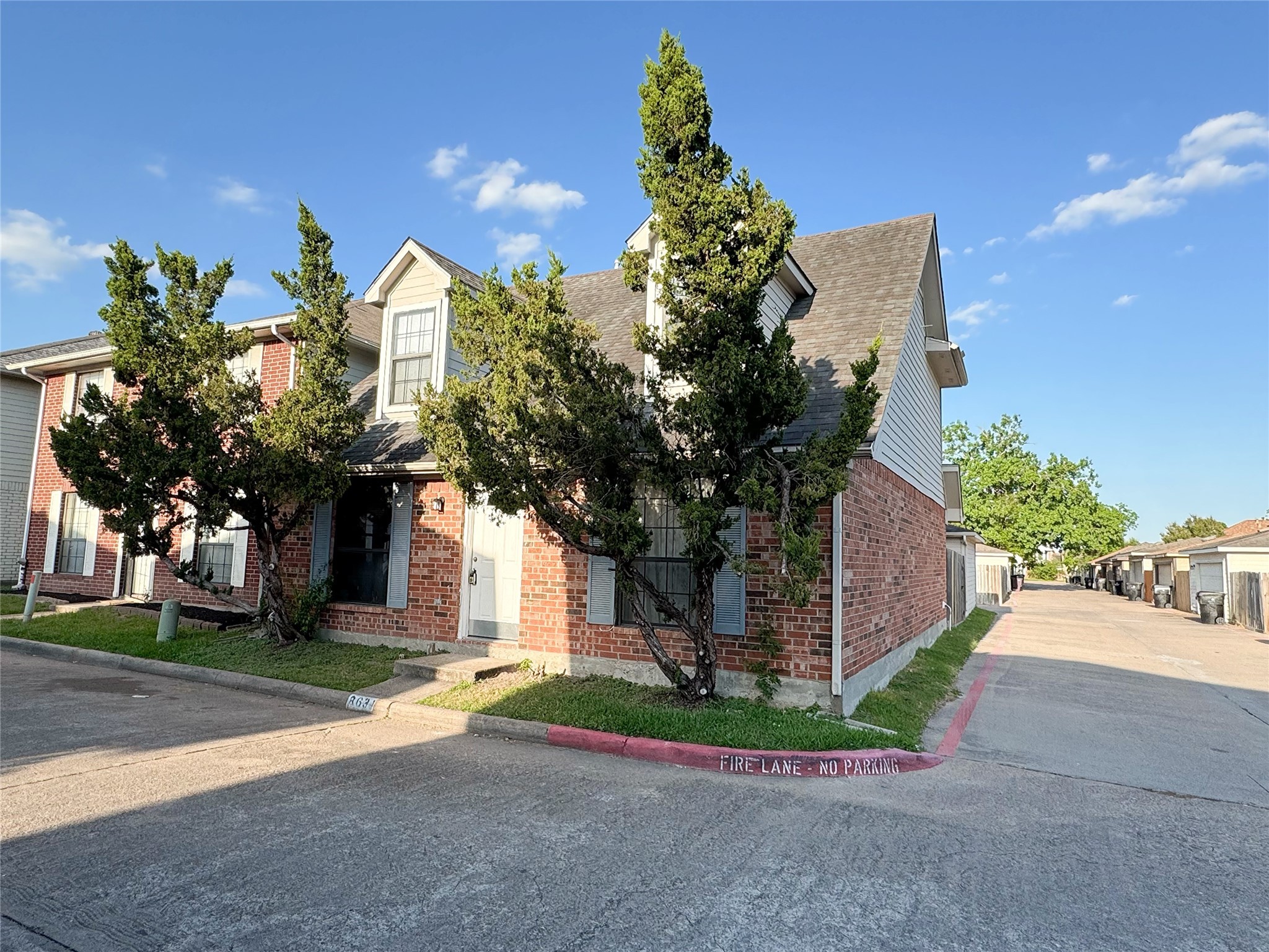 8631 Mapletwist Street Houston, TX 77083 - Photo 3 of 25 a front view of a house with a yard and a garage