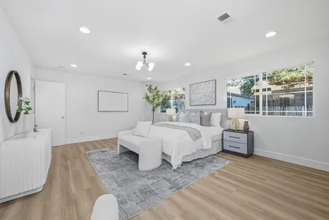 a bathroom with a double vanity sink mirror and shower