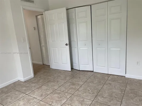 a view of room with hardwood floor