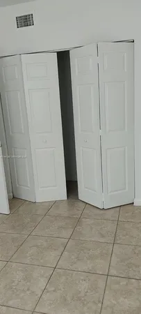 a view of entryway with white door
