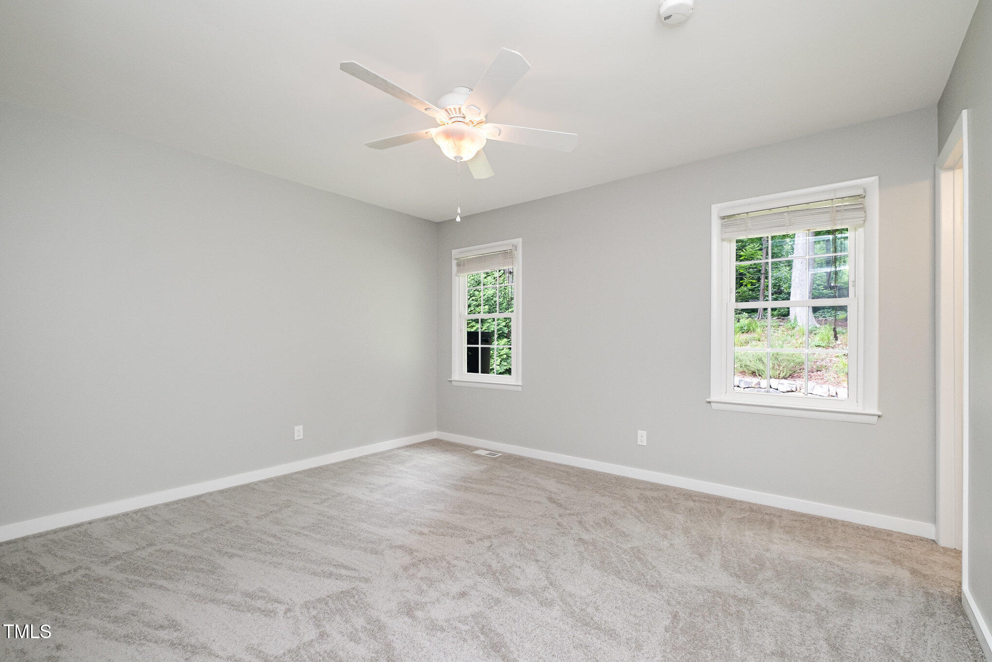 606 Chalice Street Durham, NC 27705 - Photo 15 of 41 an empty room with windows and fan