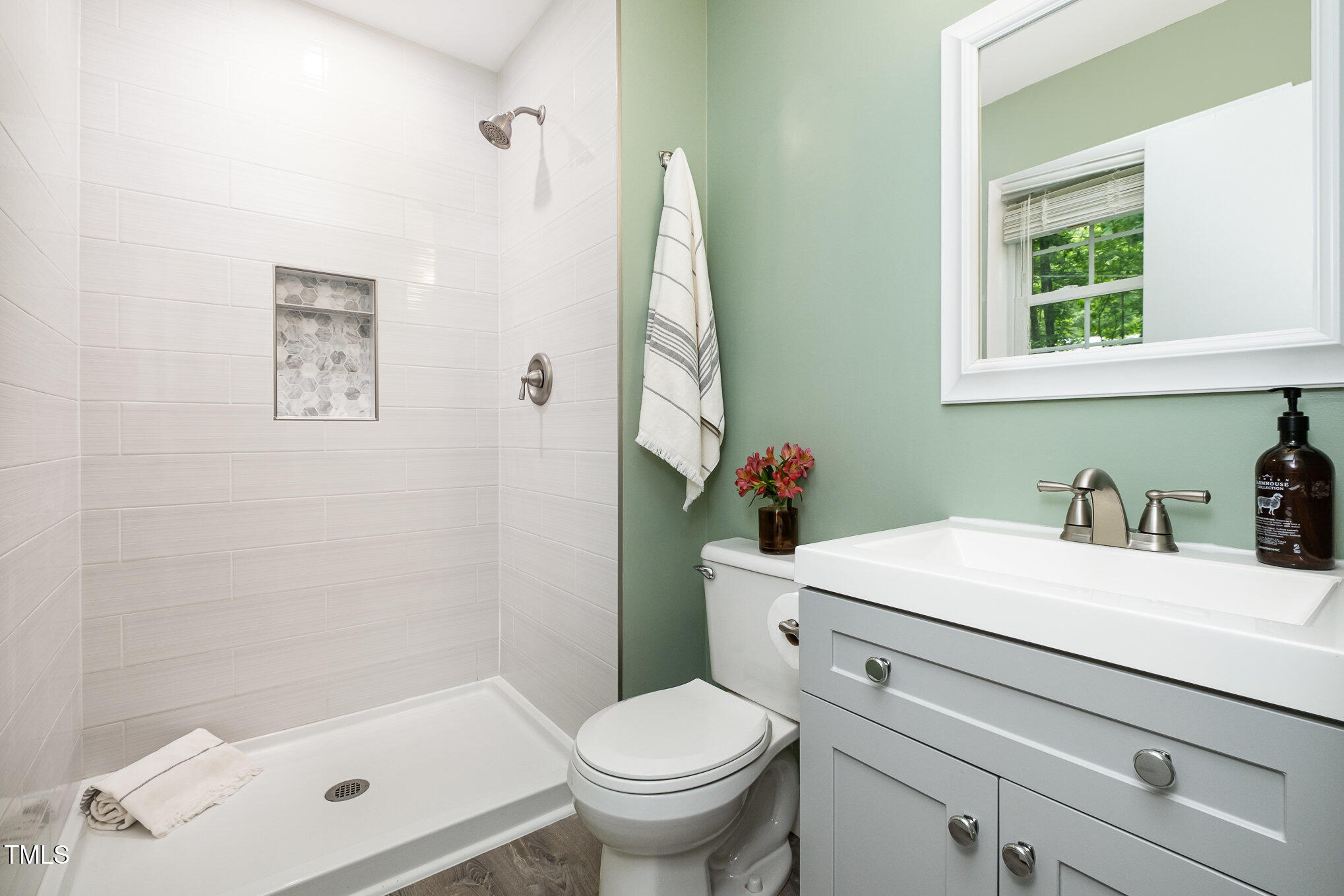 606 Chalice Street Durham, NC 27705 - Photo 16 of 41 a bathroom with a sink toilet and a mirror