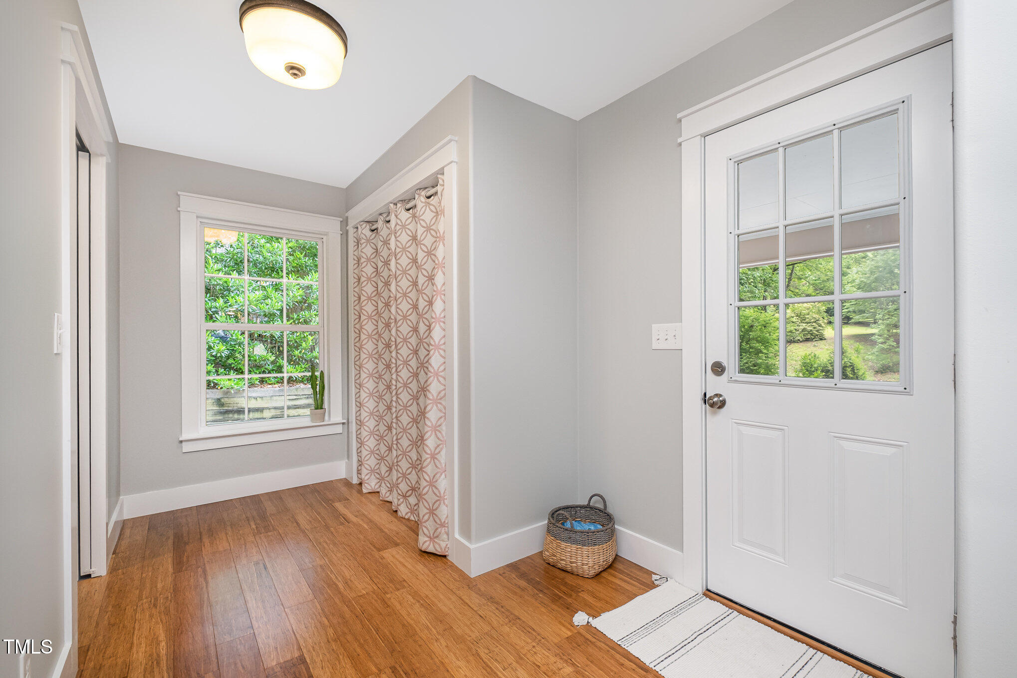 606 Chalice Street Durham, NC 27705 - Photo 19 of 41 an empty room with wooden floor and windows
