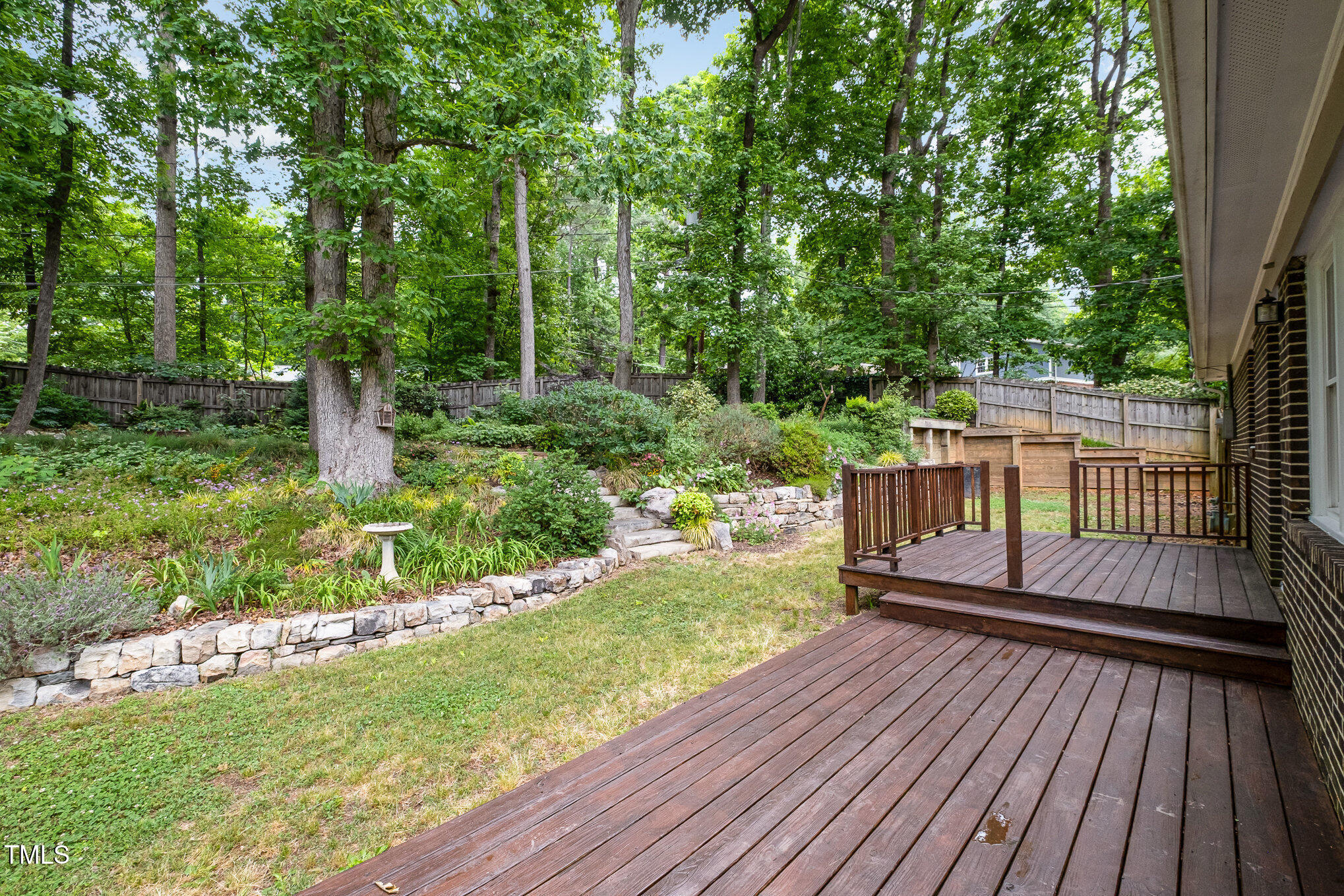 606 Chalice Street Durham, NC 27705 - Photo 21 of 41 a view of a deck with a yard chairs and wooden fence