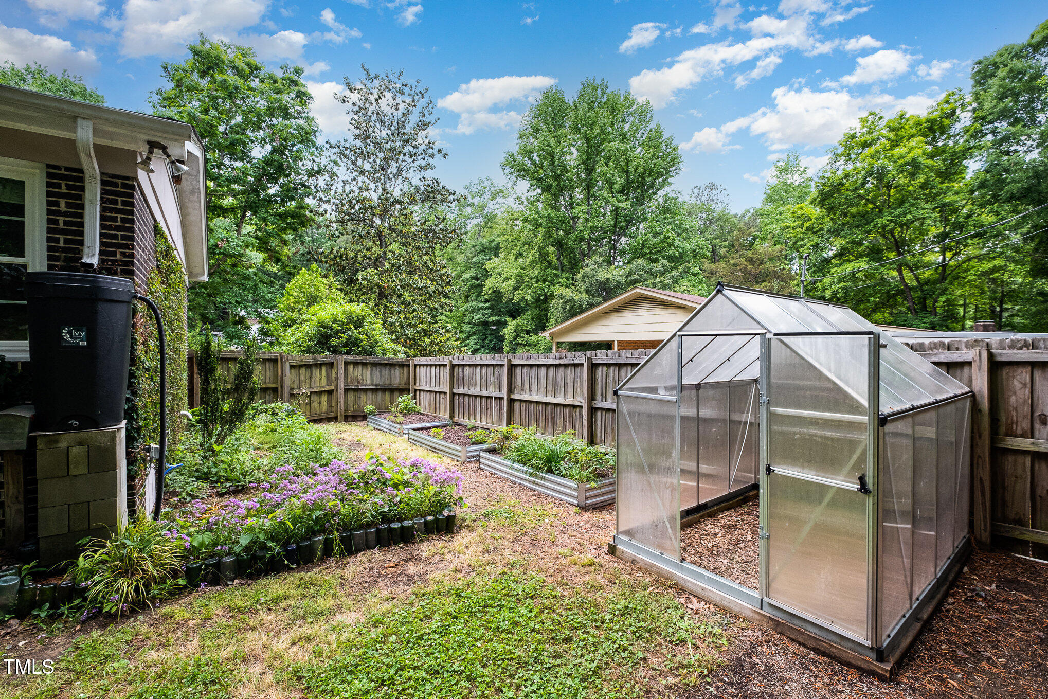 606 Chalice Street Durham, NC 27705 - Photo 26 of 41 a backyard of a house with lots of green space