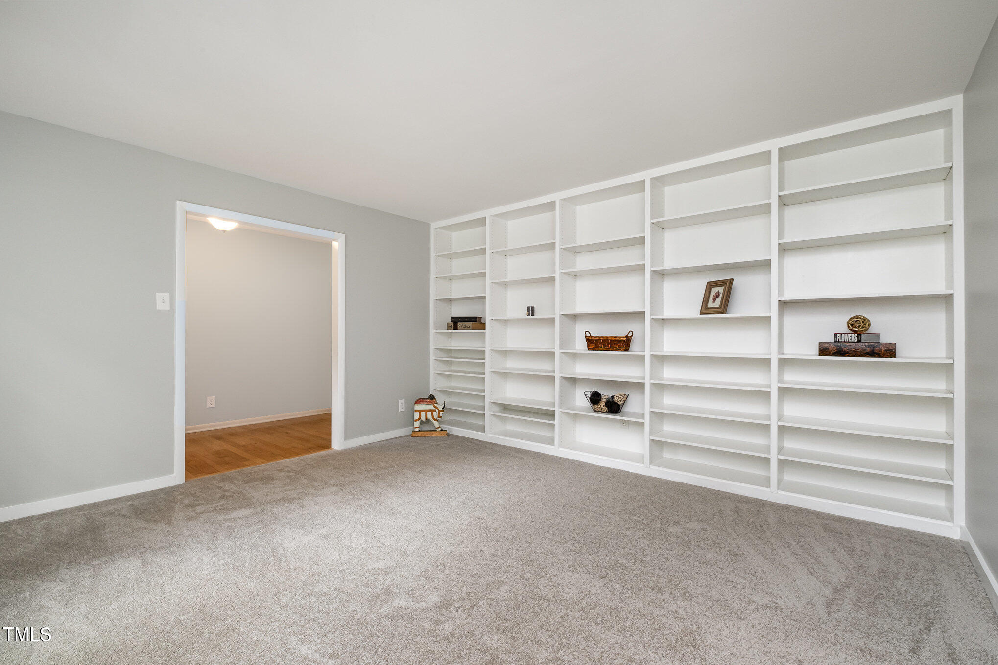 606 Chalice Street Durham, NC 27705 - Photo 5 of 41 a view of an empty room with shelves