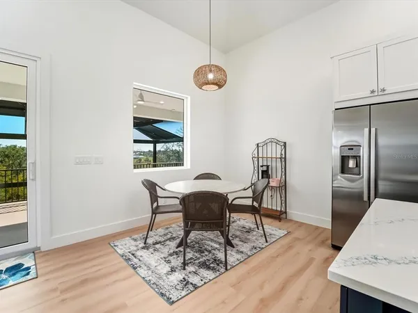 an empty room with window and wooden floor