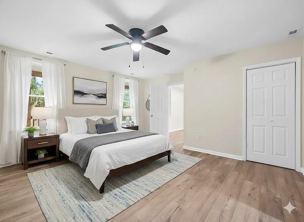 4617 Mt Troy Rd Extension Pittsburgh, PA 15214 - Photo 15 of 19 a bedroom with a large bed chandelier and a window