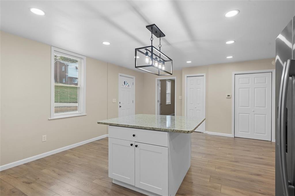 4617 Mt Troy Rd Extension Pittsburgh, PA 15214 - Photo 3 of 19 a view of a kitchen cabinets and wooden floor